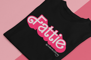 A black tshirt that reads Fattie in pink in a font similar to Barbie